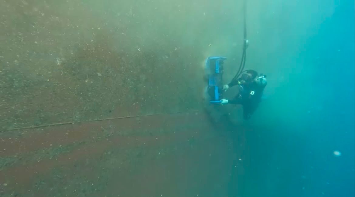 Diver performing hull inspection